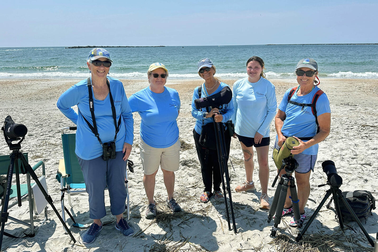 Wrightsville Beach Bird Stewards with Marlene Eader (middle) during a 5th grade student field trip. Photo: Renee Sauer Wrightsville Beach Bird Stewards with Marlene Eader (middle) during a 5th grade student field trip. Photo: Renee Sauer