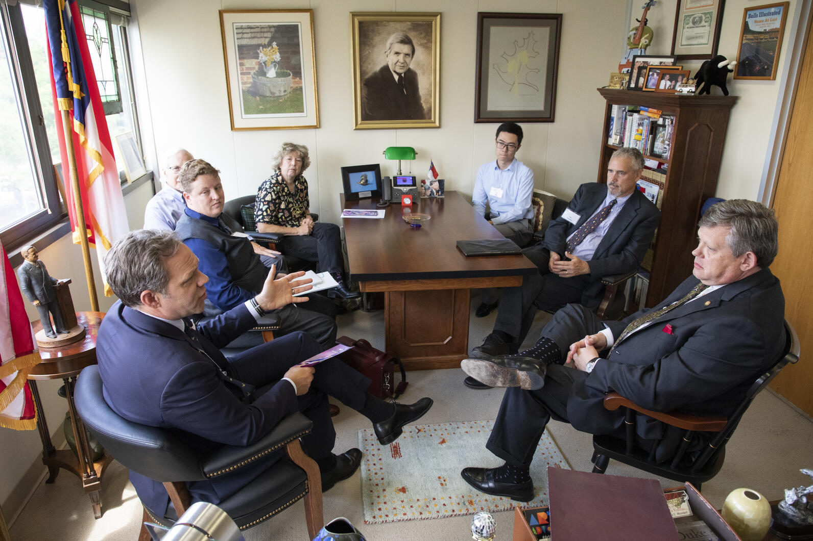 Audubon members meet with a lawmaker in his office.