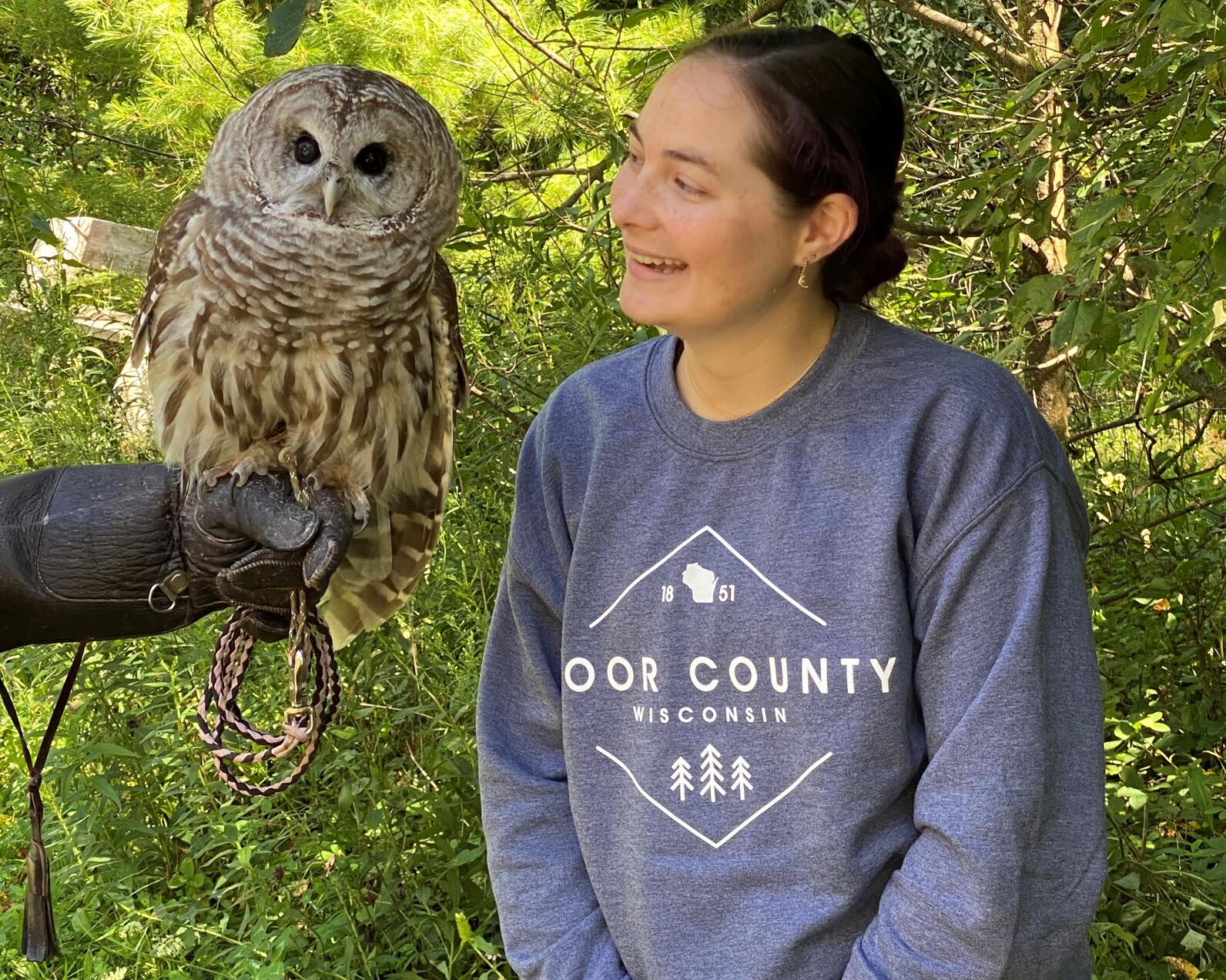 Hannah with a barred owl from the open door bird sanctuary