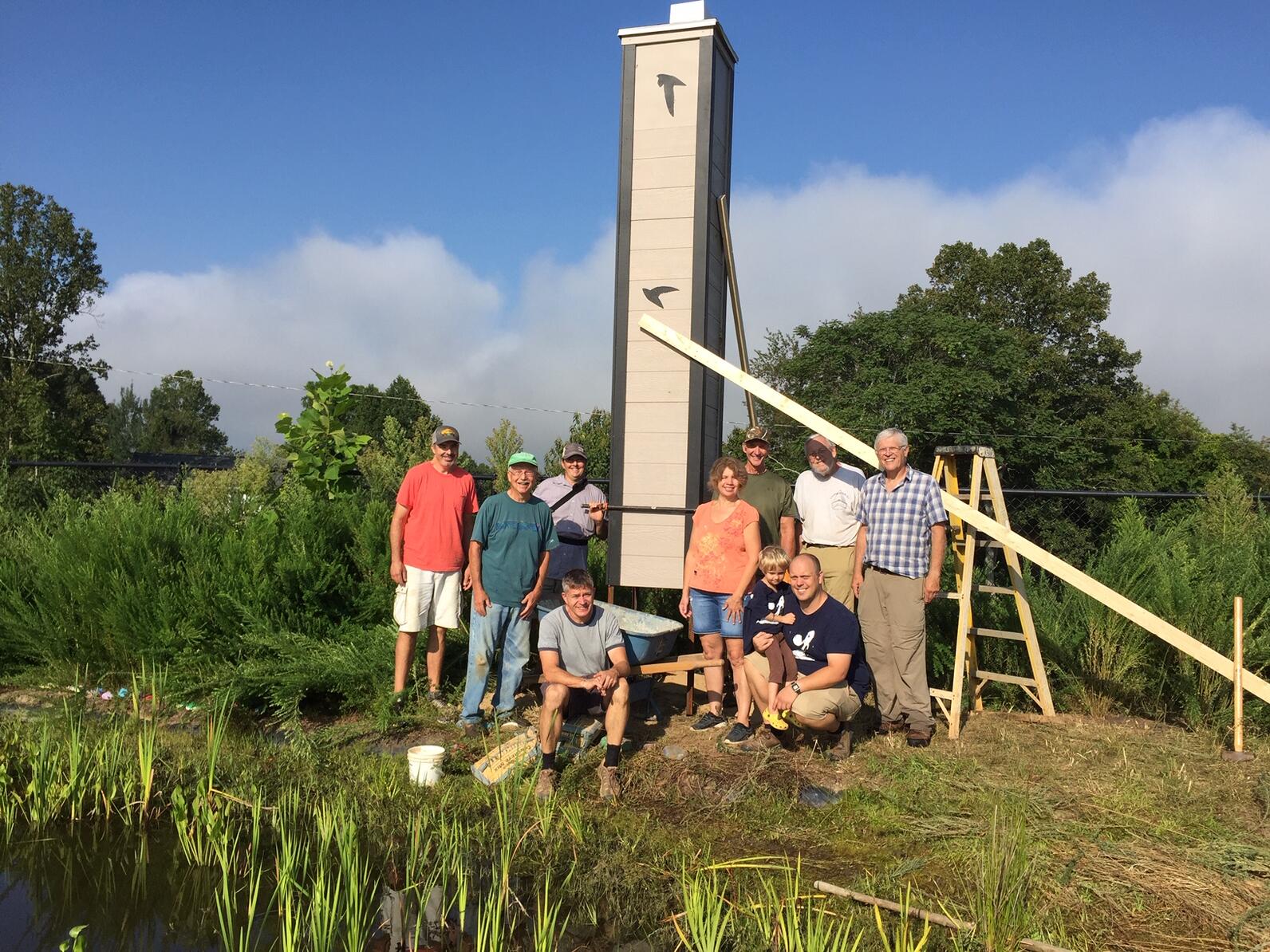 volunteers standing in front of a newly constructed Chimney Swift tower