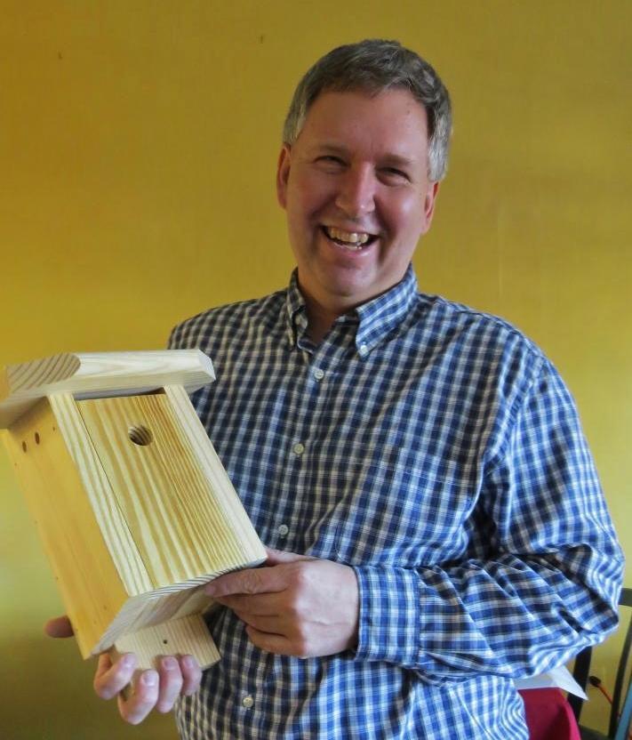 Curtis holding a Brown-headed Nuthatch nest box.