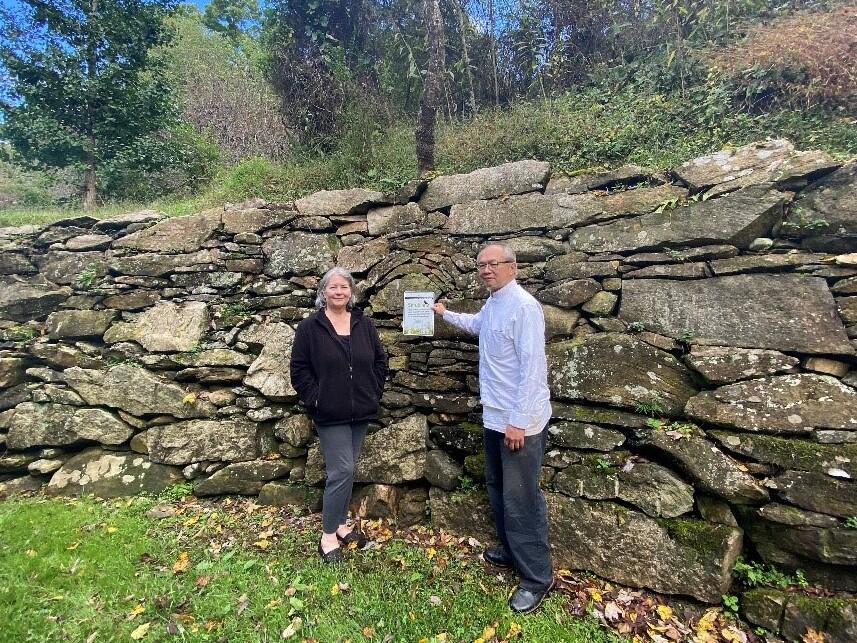 Landowners display the stewardship recognition sign presented to them by Audubon.