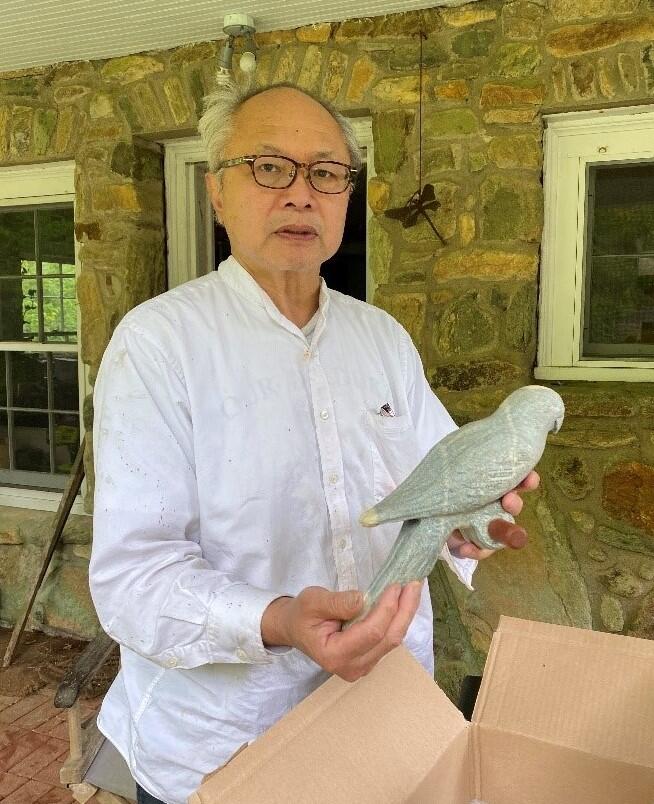 Artist Mel Chin unboxes his rendition of the Carolina Parakeet. 