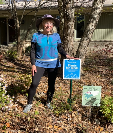 Plants for birds sign in from of home