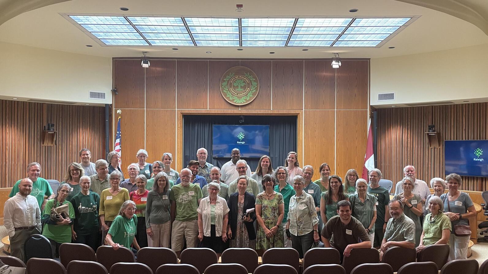 Oak folks wearing green shirts at the Raleigh committee meeting in June